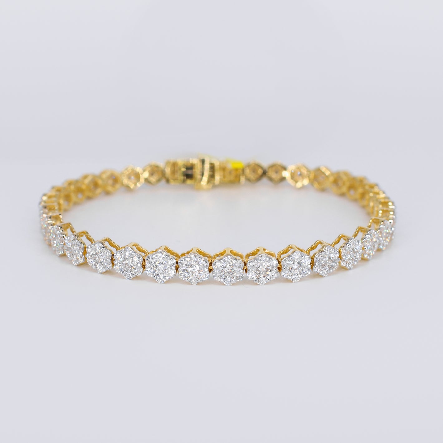 10k Solid Gold Diamond Graduated Flower Tennis Bracelet - 20198